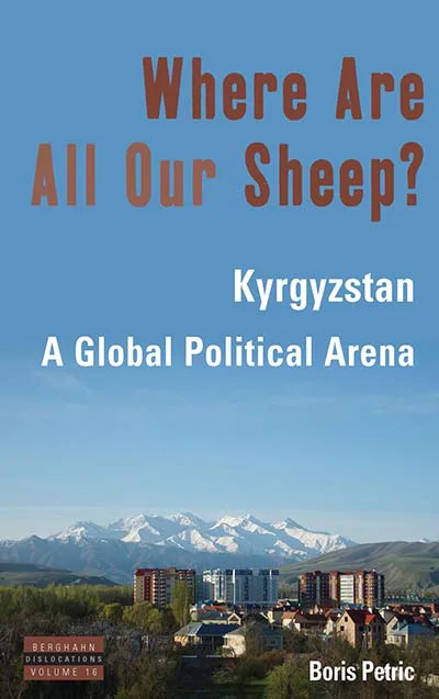 书封,天蓝背景下雪山连绵、山脚是城镇楼群,书名《Where Are All Our Sheep?》以赭红色大字印于上方,副标题为白色小字。
