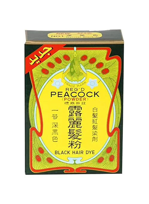 黄绿色包装盒,印有孔雀图案商标及'PEACOCK POWDER 露丽髮粉 BLACK HAIR DYE'字样,盒角贴着红色阿拉伯文新品标签。