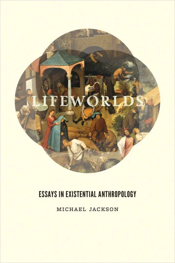 封面书名《Lifeworlds: Essays in Existential Anthropology》,作者 Michael Jackson,中央是一幅圆形的老彼得·勃鲁盖尔风格古典油画,描绘中世纪欧洲市集人群场景。