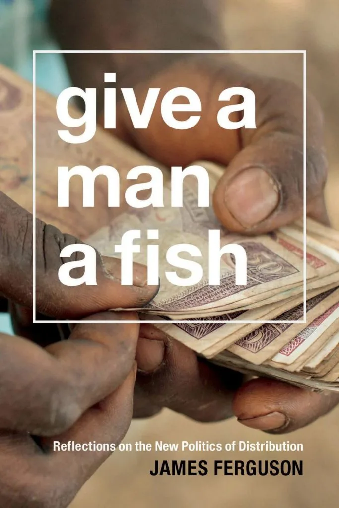 封面书名《Give a Man a Fish: Reflections on the New Politics of Distribution》,作者 James Ferguson,背景是一双双手正在清点纸币的特写照片。